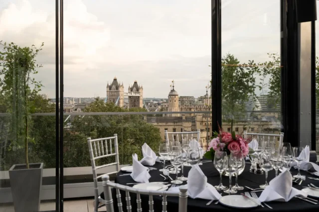 The Skyline London - view of a table setup for dinner with a floral centre piece
